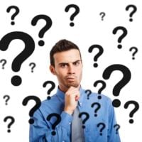 stock photo man surrounded by question marks